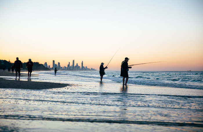 Sunset fishing on beach