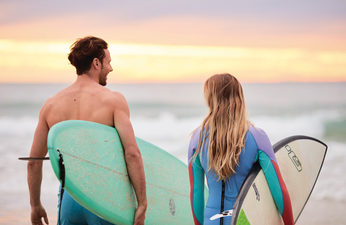 Surfers at sunrise